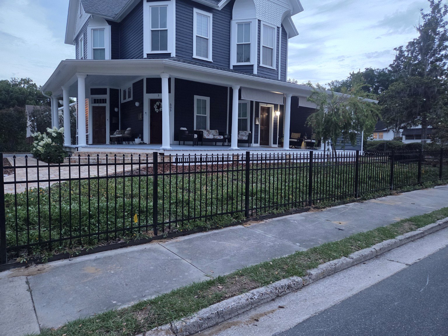 Black aluminum fence installation Ocala FL