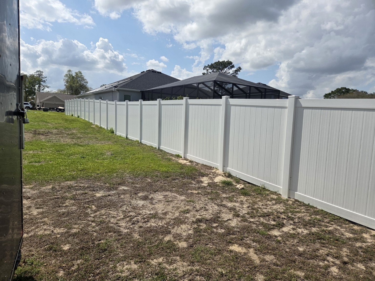 White vinyl privacy fence installed by Marion Fence LLC in Central Florida